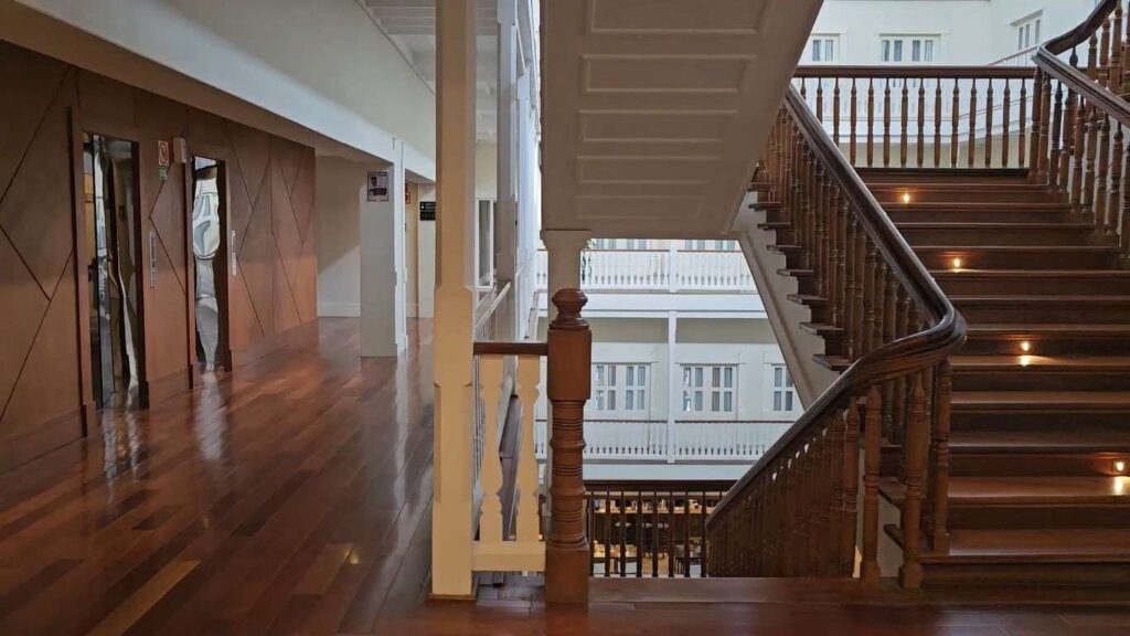 Interior view of Central Hotel Panama featuring wooden staircase and elegant colonial design