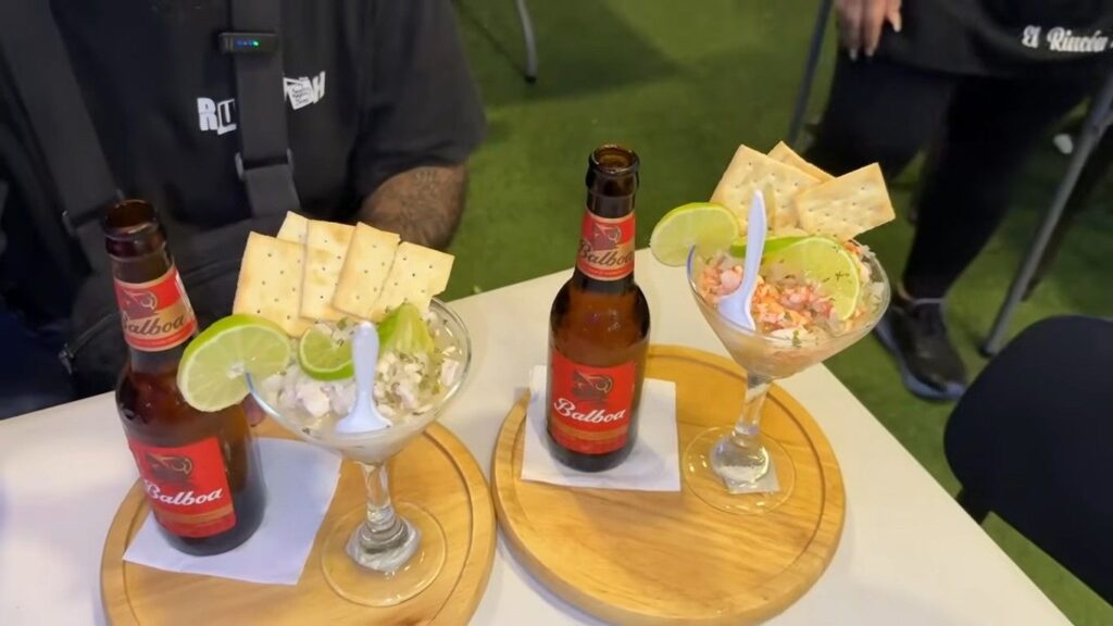 Fish ceviche served with crackers and bottled drinks at mercado de mariscos