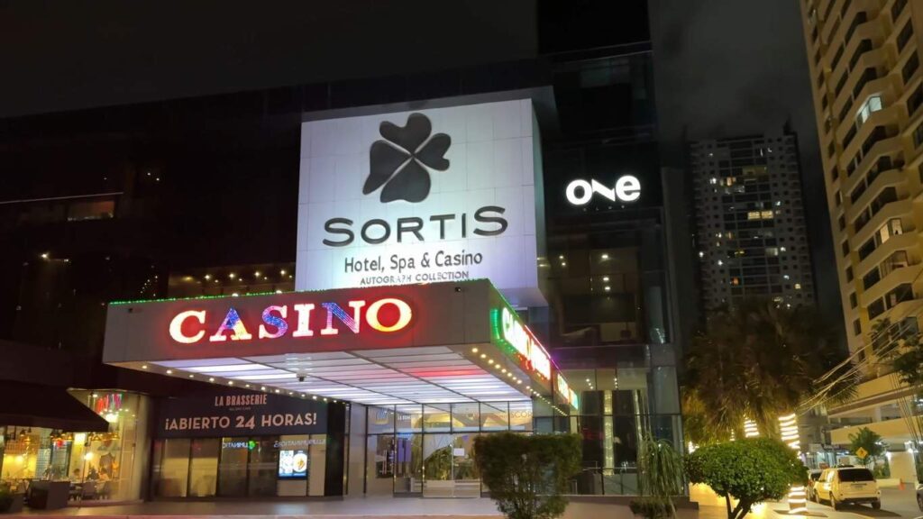 Exterior view of Sortis Hotel Spa and Casino illuminated at night in Panama City