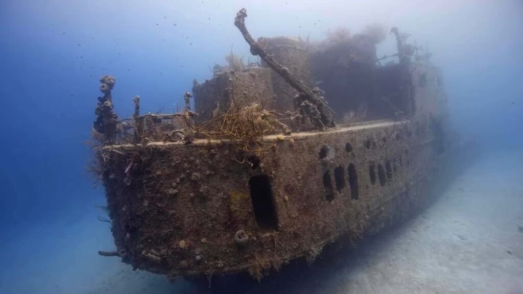 Underwater view of a sunken shipwreck resting on the seabed in the San Blas Islands