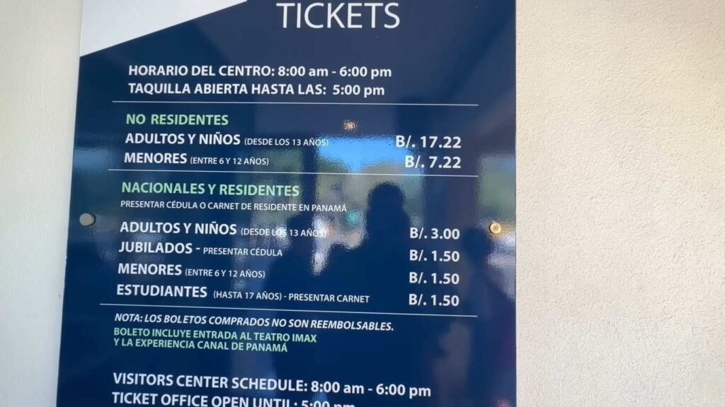 Ticket price board at Panama Canal Visitor Center with entry and IMAX theater details